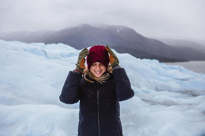 Woman visiting Glacier in South America